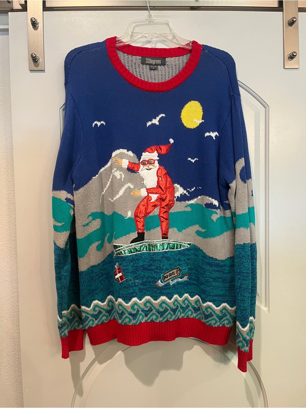 Ugly Christmas style Blue Surfing Santa Holiday Sweater. So cute!!